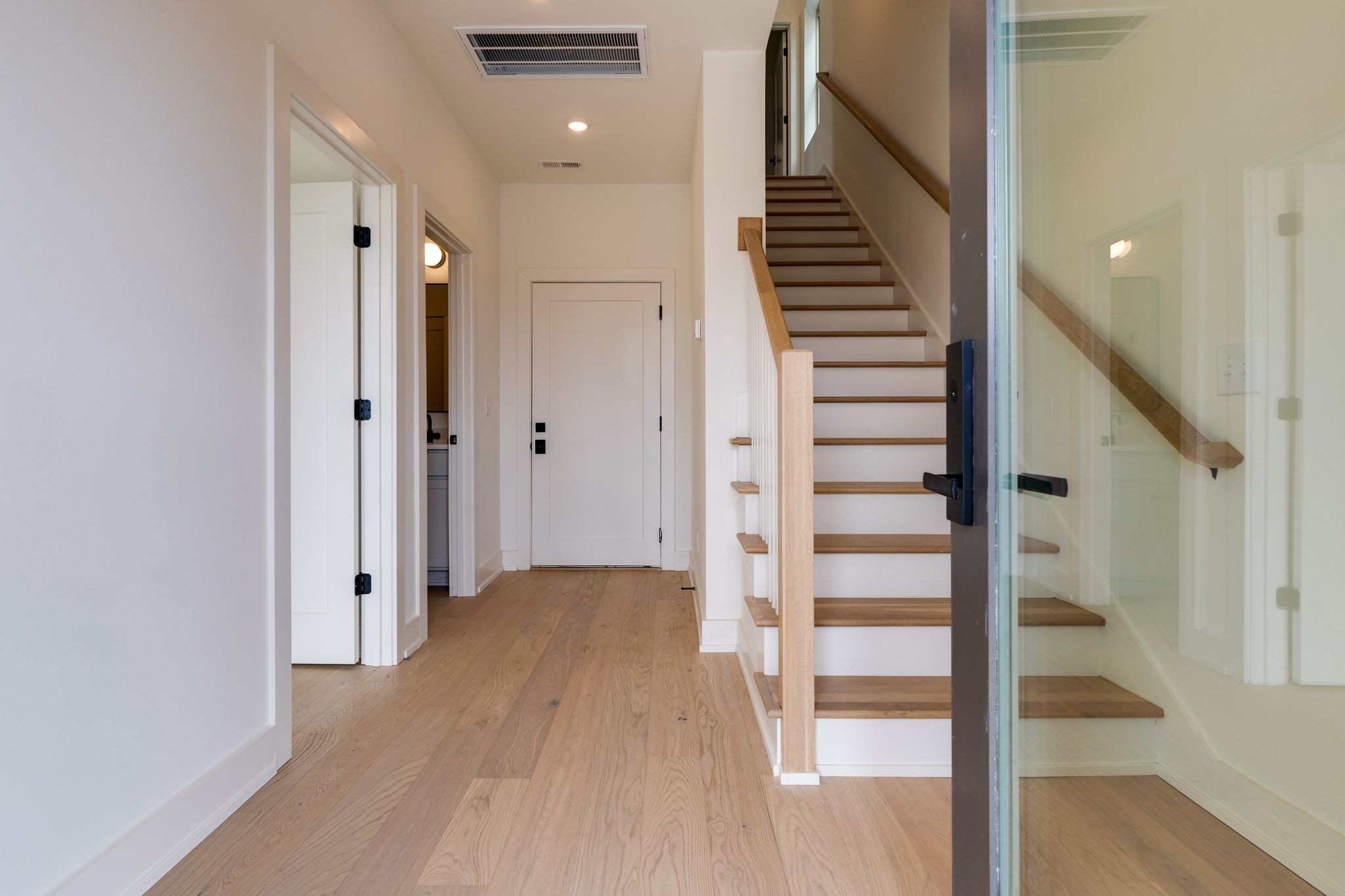 531 Midnight Way Nashville, TN 37209 - Photo 2 of 44 a view of a hallway with wooden floor and staircase