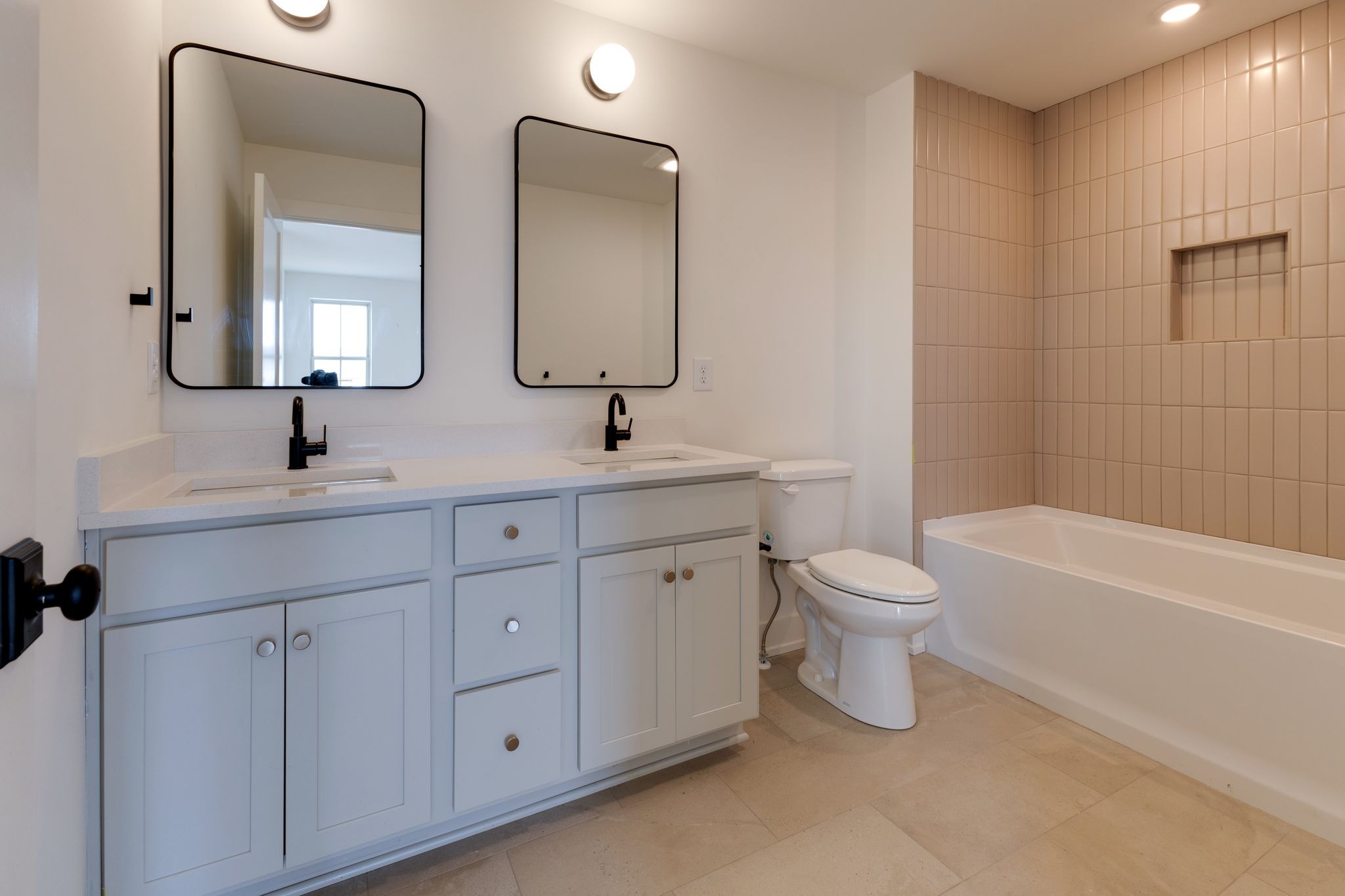 531 Midnight Way Nashville, TN 37209 - Photo 23 of 44 a bathroom with a double vanity sink a toilet a mirror and shower