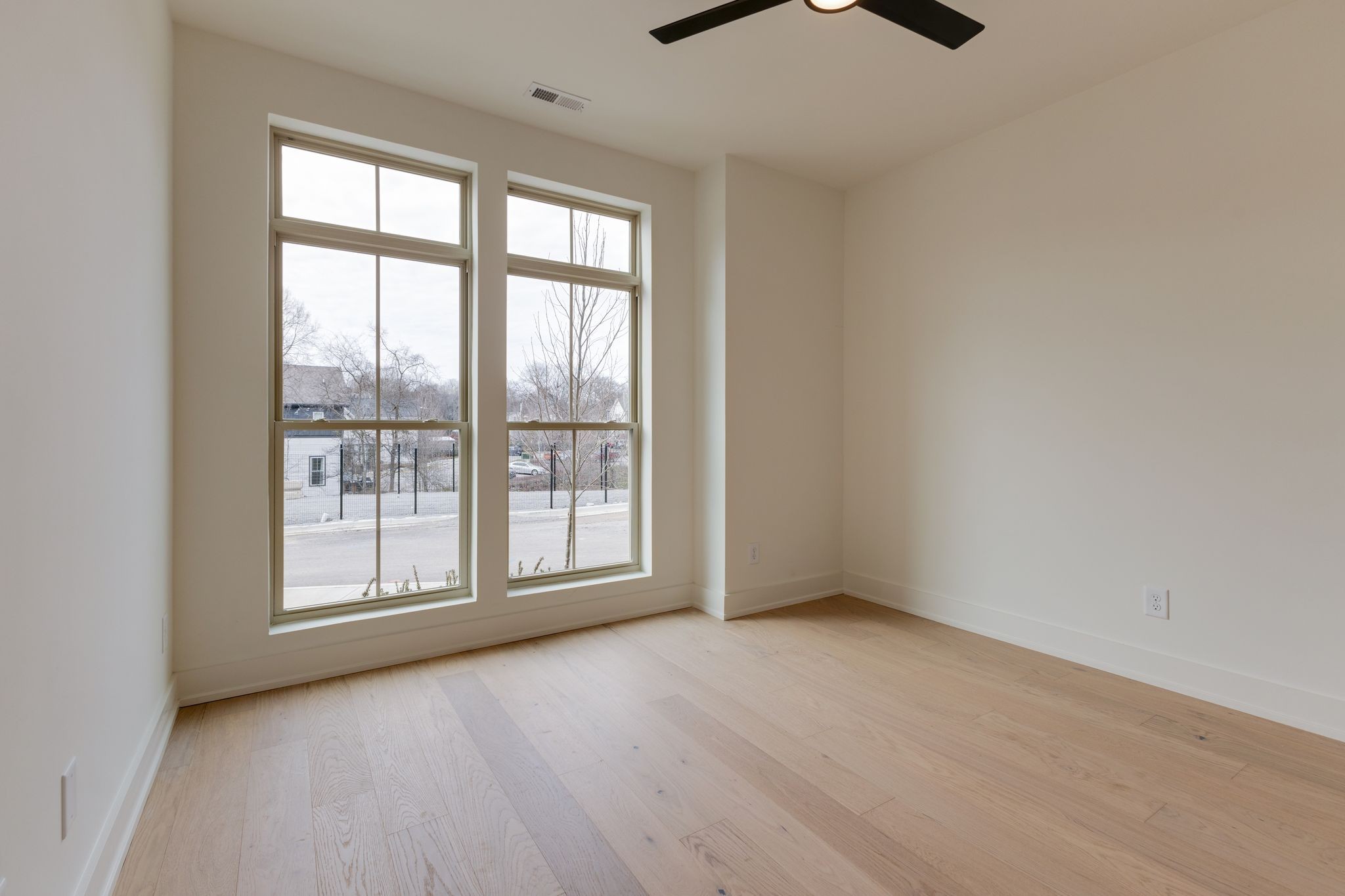 531 Midnight Way Nashville, TN 37209 - Photo 4 of 44 an empty room with wooden floor and windows
