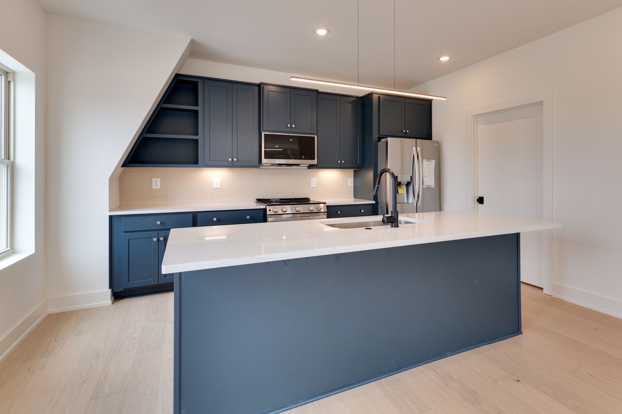 531 Midnight Way Nashville, TN 37209 - Photo 10 of 44 a kitchen with stainless steel appliances a sink and a refrigerator