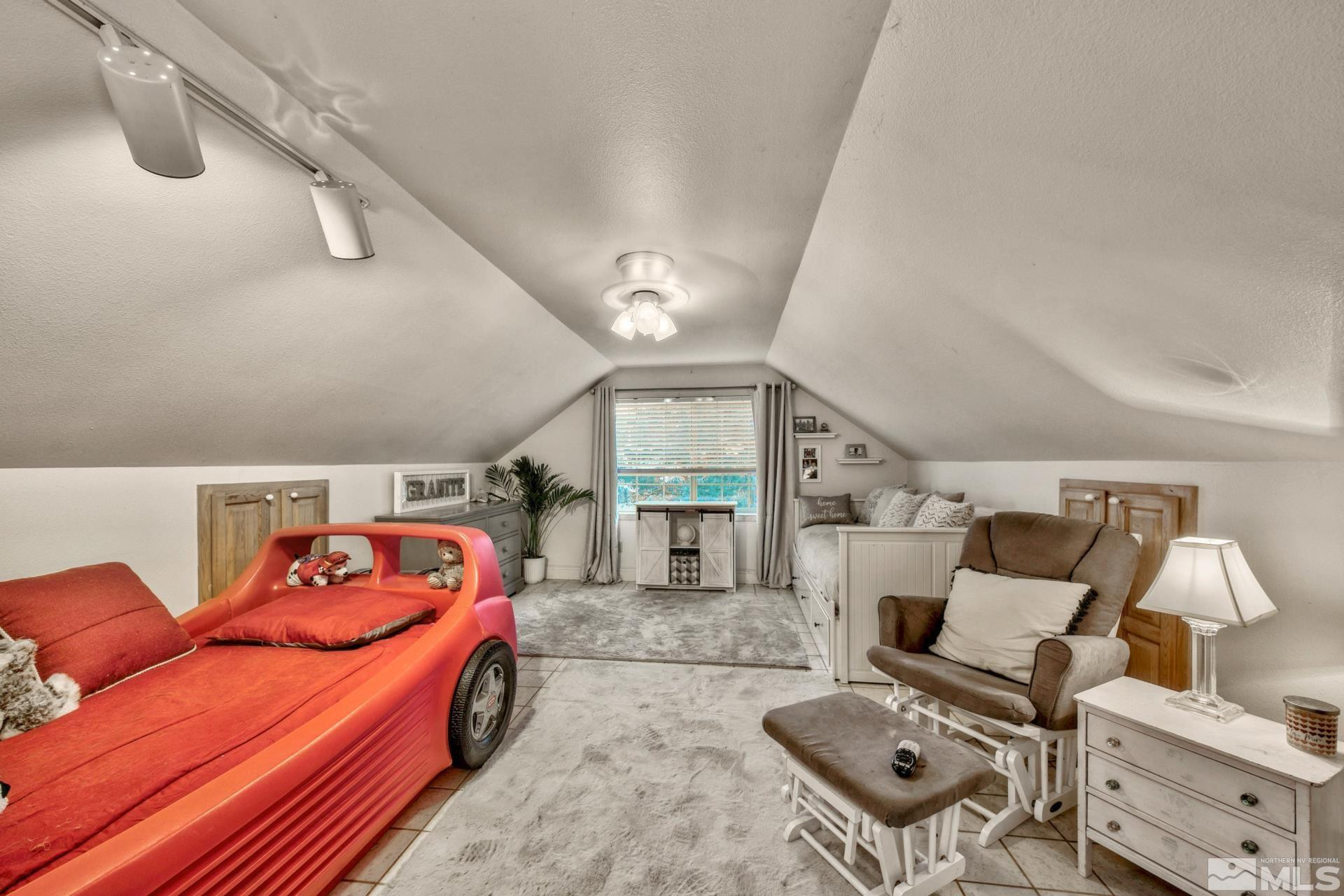 1980 Emigrant Trail Woodfords, CA 96120 - Photo 29 of 40 a bedroom with furniture and a large window