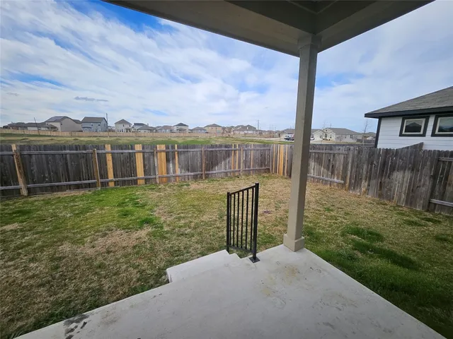 a view of a house with a yard and a table