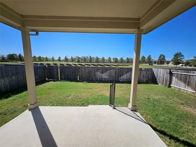a view of a backyard with a garden and plants