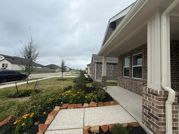 a front view of a house with garden