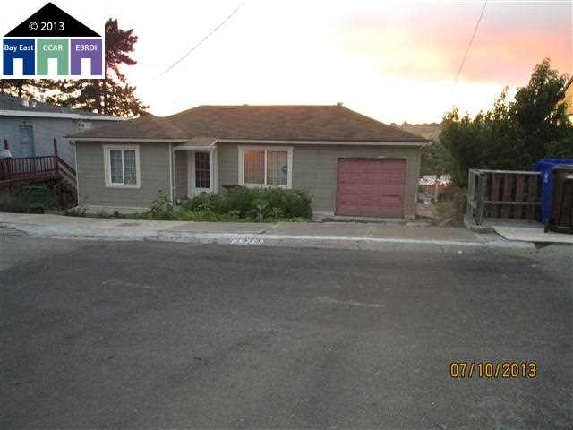 3969 La Cresenta Road El Sobrante, CA 94803 - Photo 1 of 1 a front view of house with yard and trees in the background