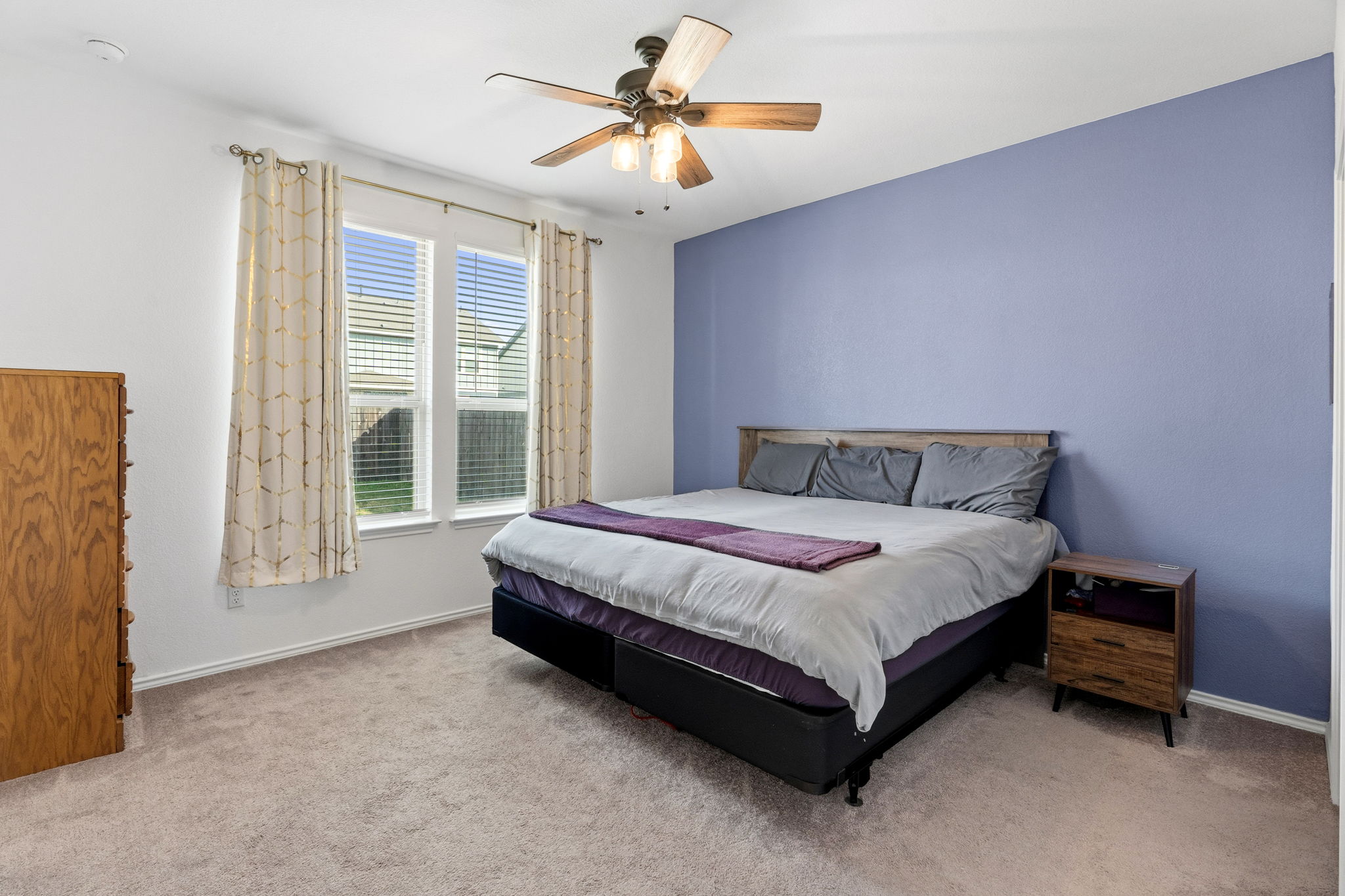1600 Hope Rnch Road Leander, TX 78641 - Photo 19 of 29 Bedroom with light colored carpet and ceiling fan