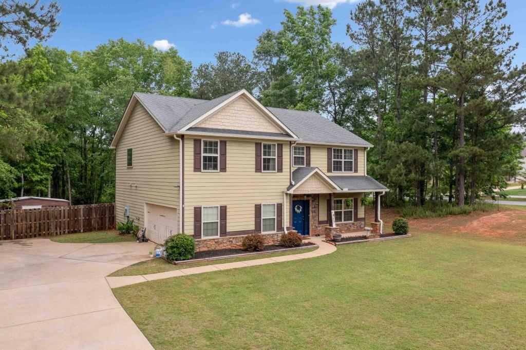 14 Oak Leaf Way Hamilton, GA 31811 - Photo 1 of 1 a front view of a house with yard porch and tree