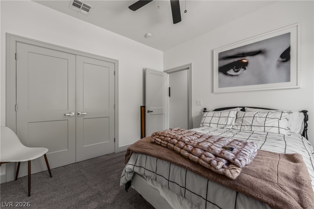 3020 Hannig Street Logandale, NV 89021 - Photo 43 of 75 Plush carpet and a functional ceiling fan offer comfort in this relaxing sleeping space.