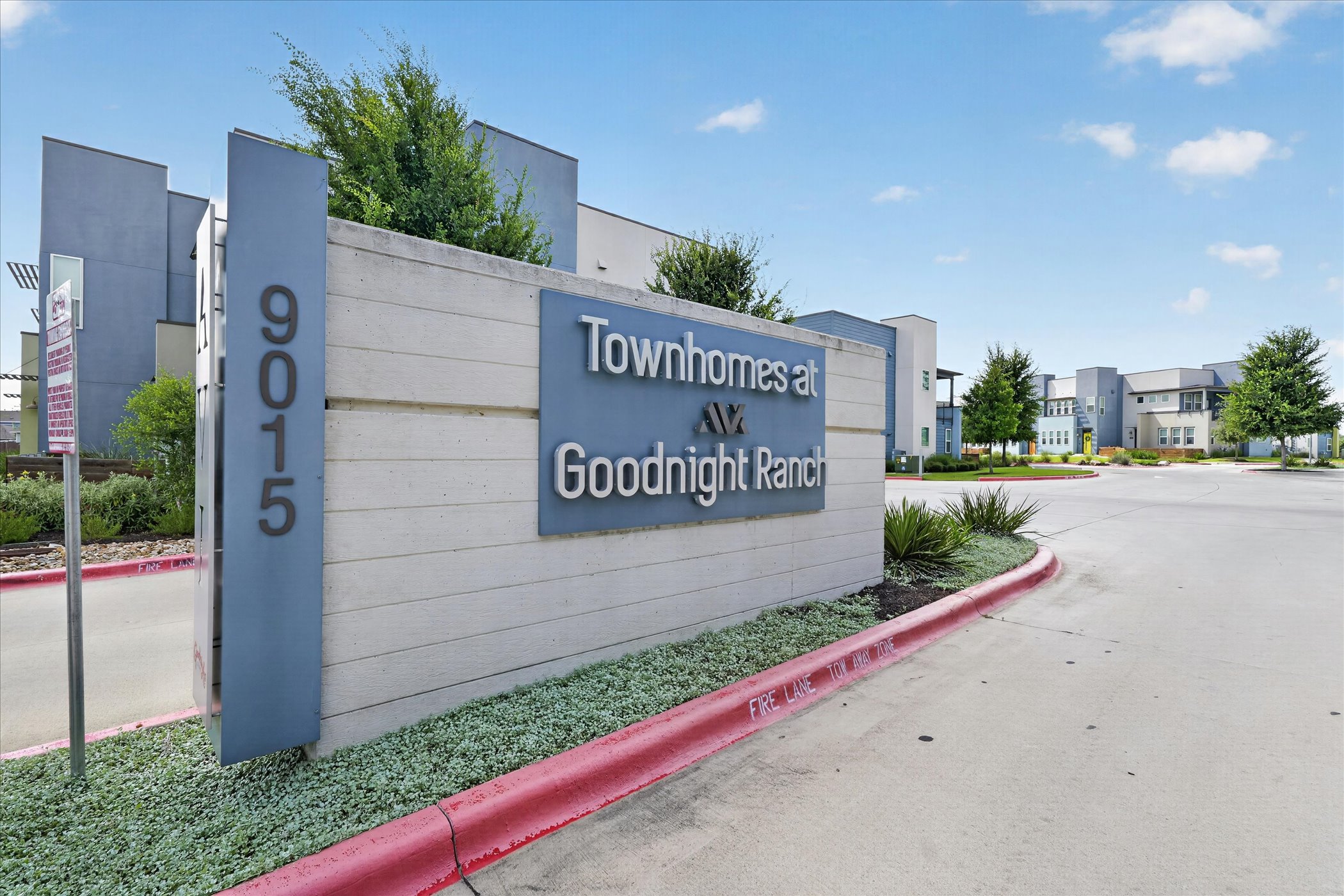 9015 Cattle Baron Path, Unit 1102 Austin, TX 78747 - Photo 24 of 25 A welcoming entry sign marks the modern townhomes of Goodnight Ranch.
