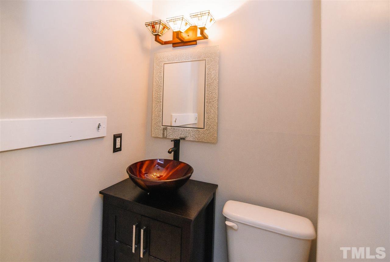 3904 Wendy Lane Raleigh, NC 27606 - Photo 8 of 18 Conveniently located on the 1st floor, this bath features a modern, vessel sink! Perfect for guests!