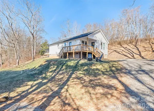 a house that has tree in front of it