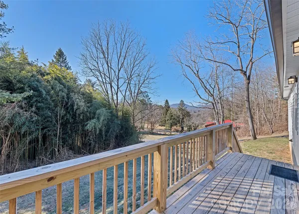 a view of a balcony with wooden fence