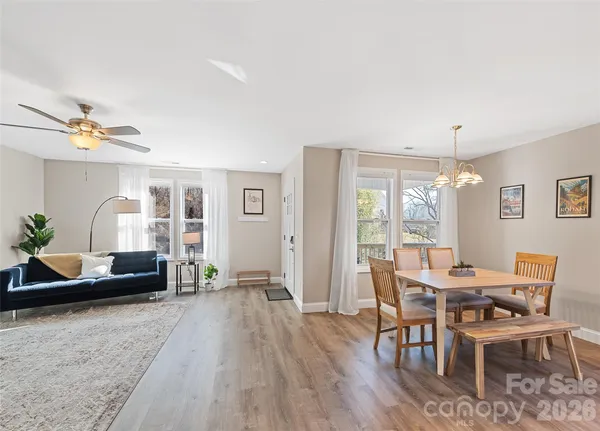 a view of a dining room with furniture window and wooden floor