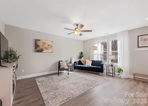 a living room with furniture and a rug