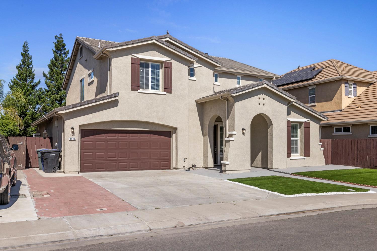 3105 Ripple Court Modesto, CA 95355 - Photo 2 of 46 a front view of a house with a yard and garage