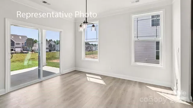 a view of an empty room with glass door