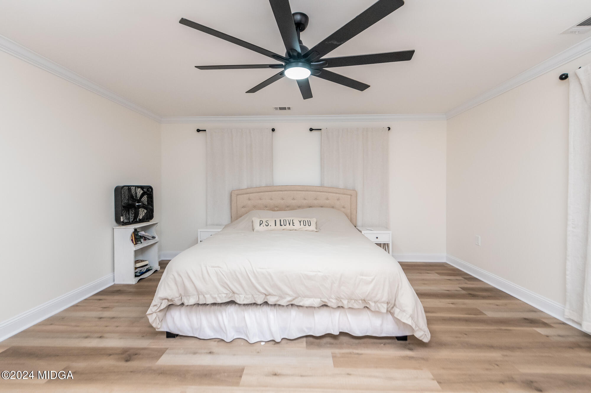 2454 Union Church Road Fort Valley, GA 31030 - Photo 11 of 50 a bedroom with a bed and a ceiling fan
