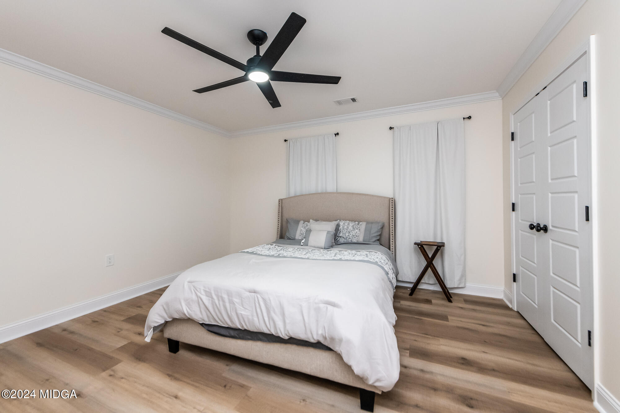 2454 Union Church Road Fort Valley, GA 31030 - Photo 29 of 50 a bedroom with a bed and a ceiling fan