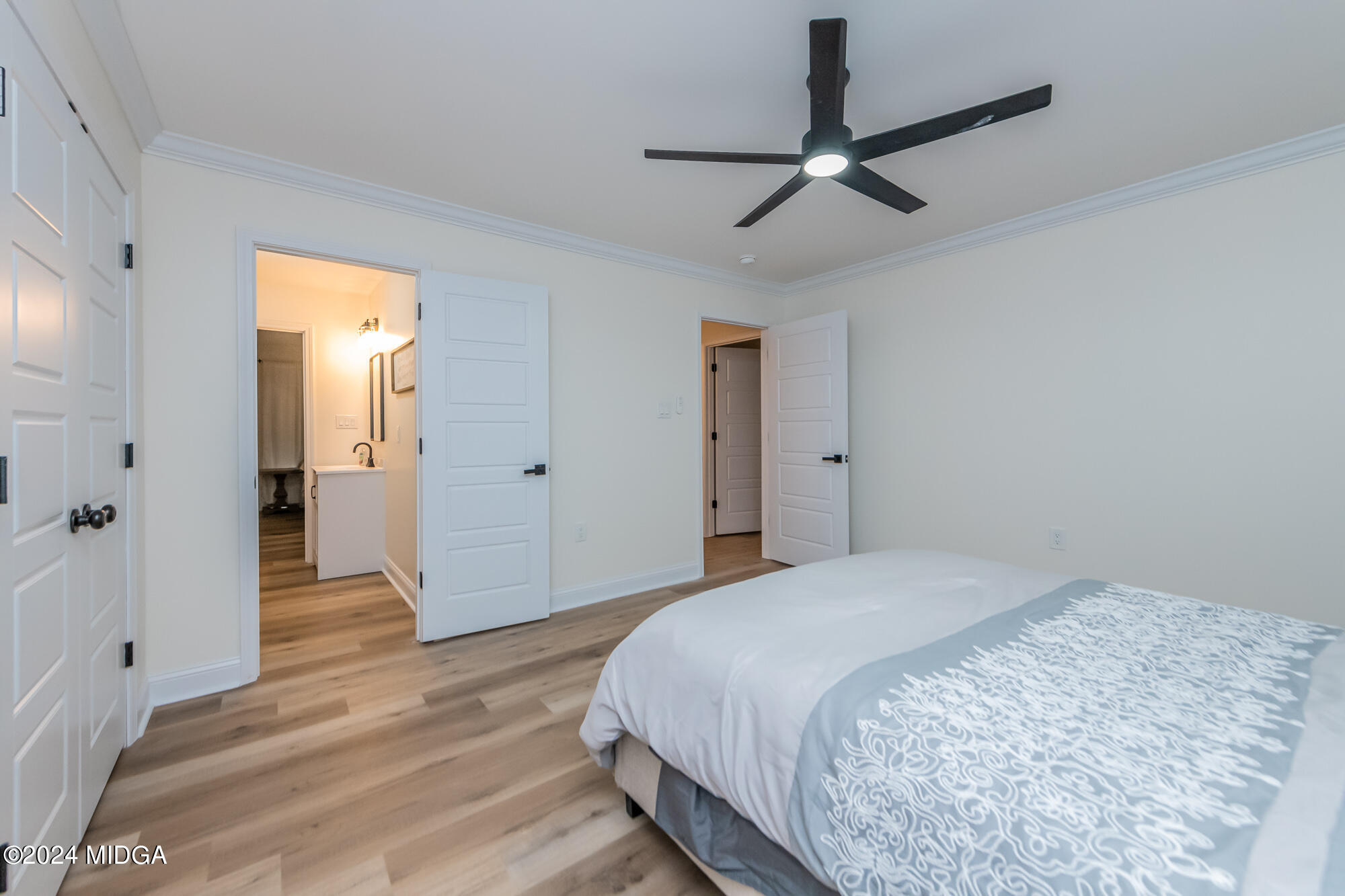 2454 Union Church Road Fort Valley, GA 31030 - Photo 32 of 50 a bedroom with a bed and a ceiling fan