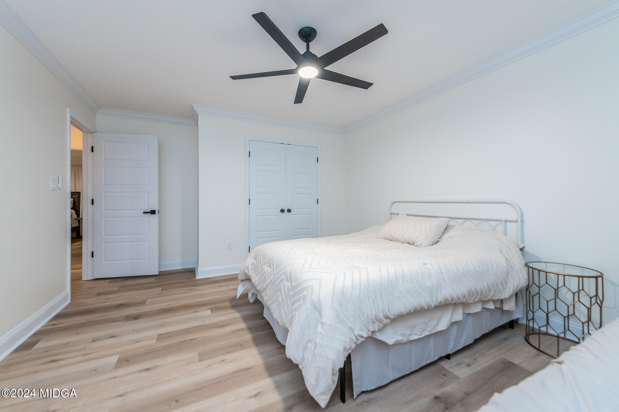 2454 Union Church Road Fort Valley, GA 31030 - Photo 36 of 50 a bedroom with a bed and ceiling fan