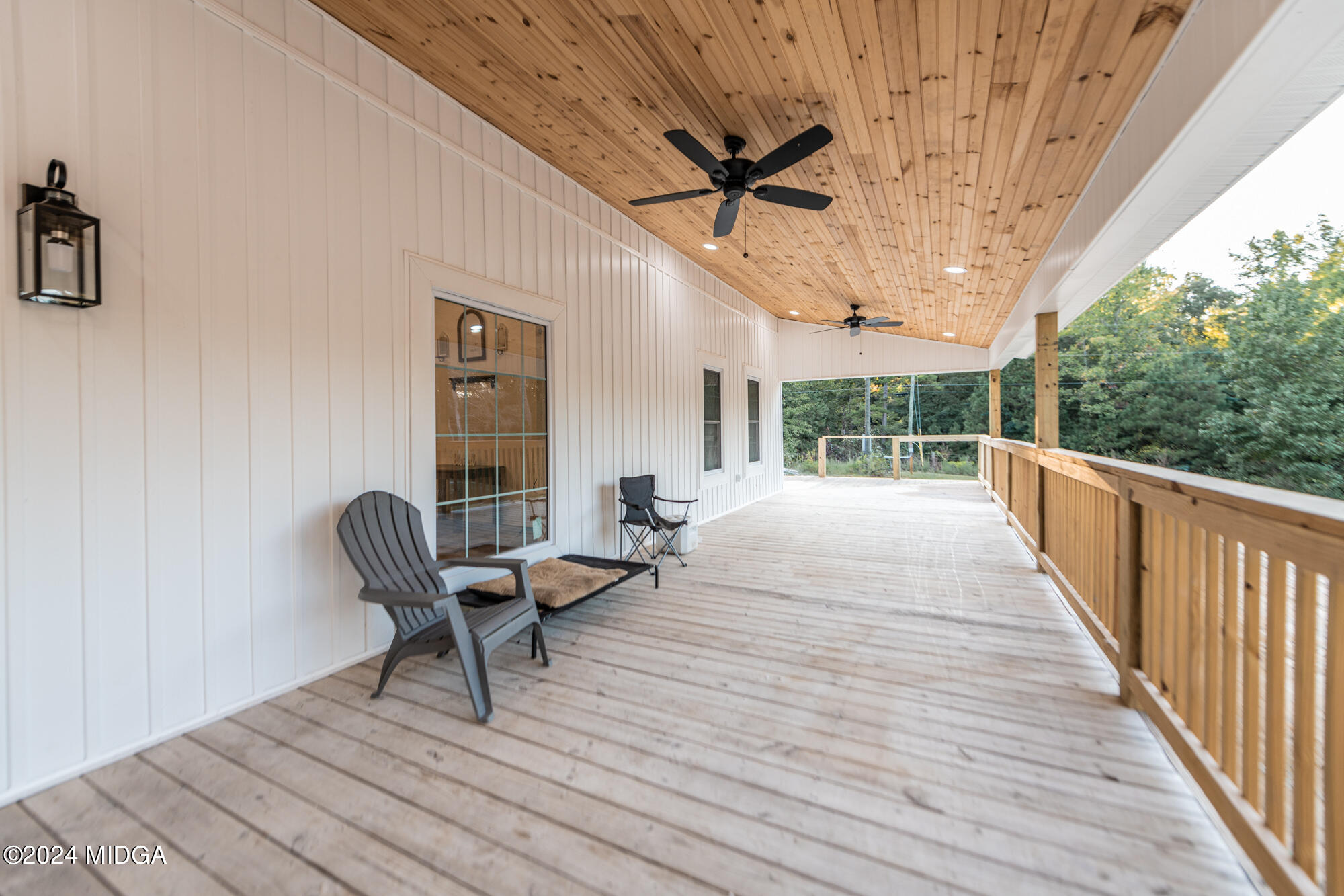 2454 Union Church Road Fort Valley, GA 31030 - Photo 7 of 50 a balcony with wooden floor and outdoor seating