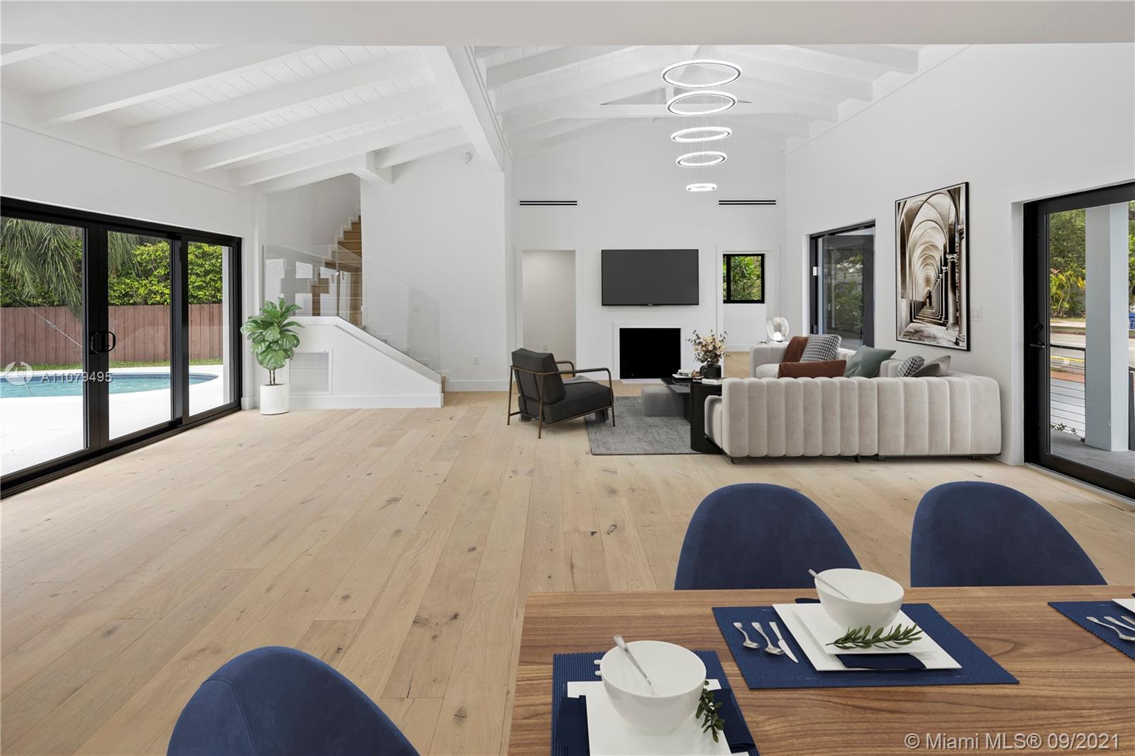 4450 Alton Road Miami Beach, FL 33140 - Photo 11 of 35 a living room with fireplace furniture and a large window