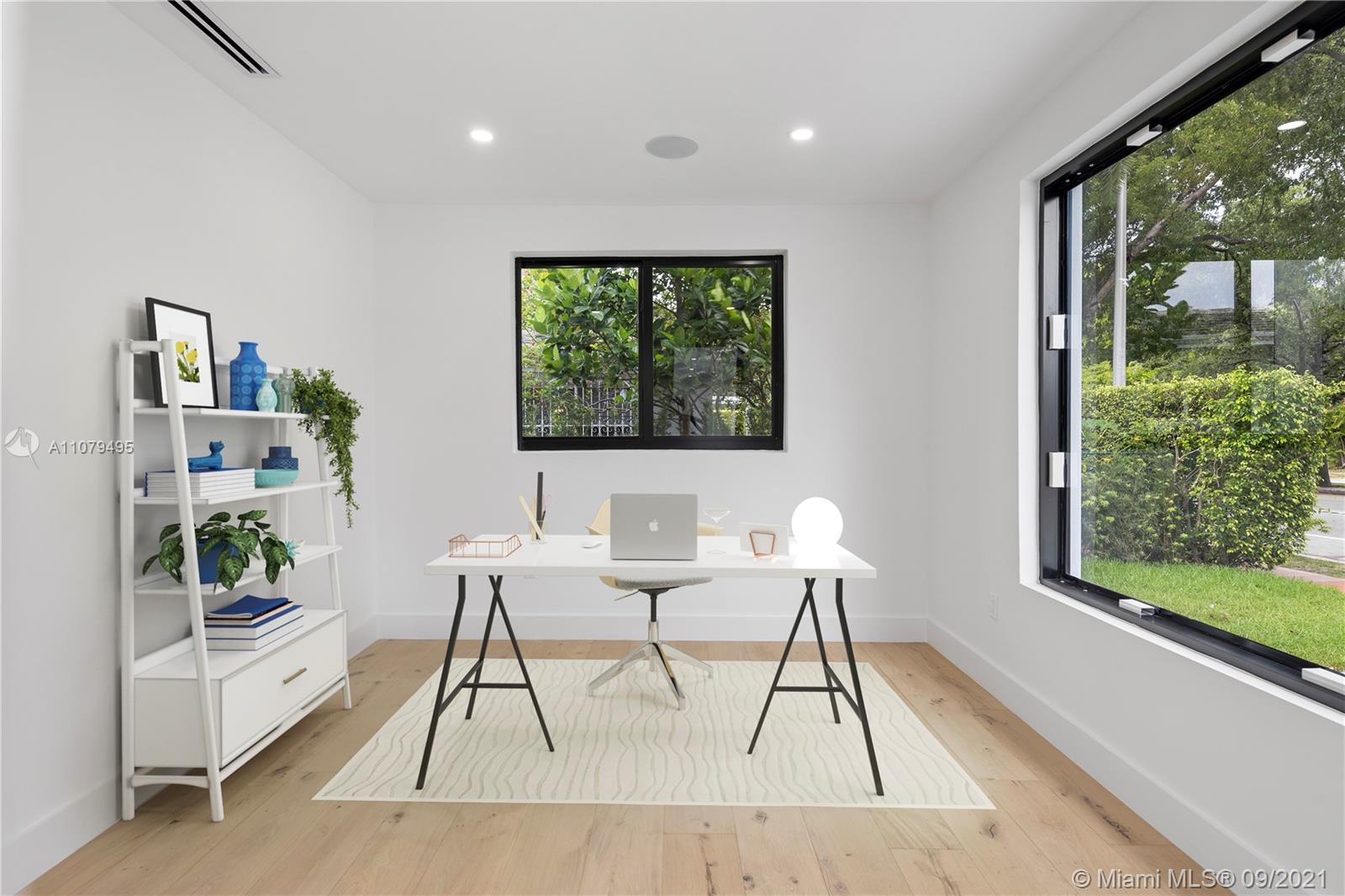 4450 Alton Road Miami Beach, FL 33140 - Photo 16 of 35 a work room with furniture and a large window