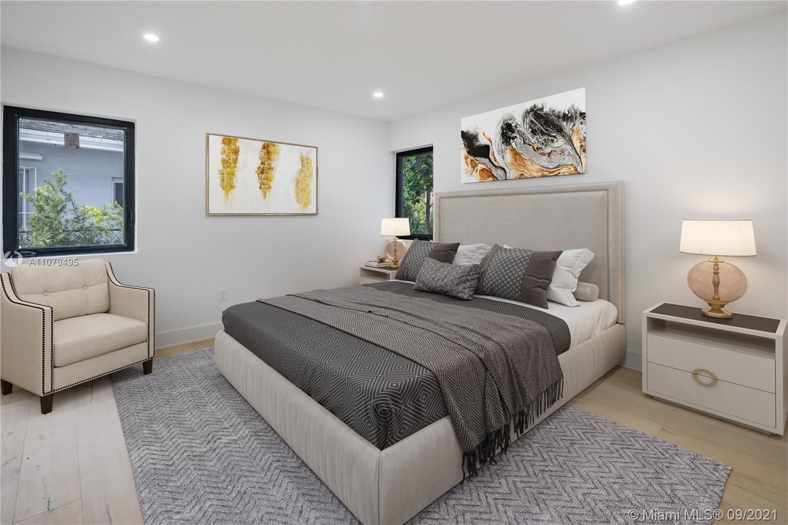 4450 Alton Road Miami Beach, FL 33140 - Photo 18 of 35 a bedroom with a bed and a couch