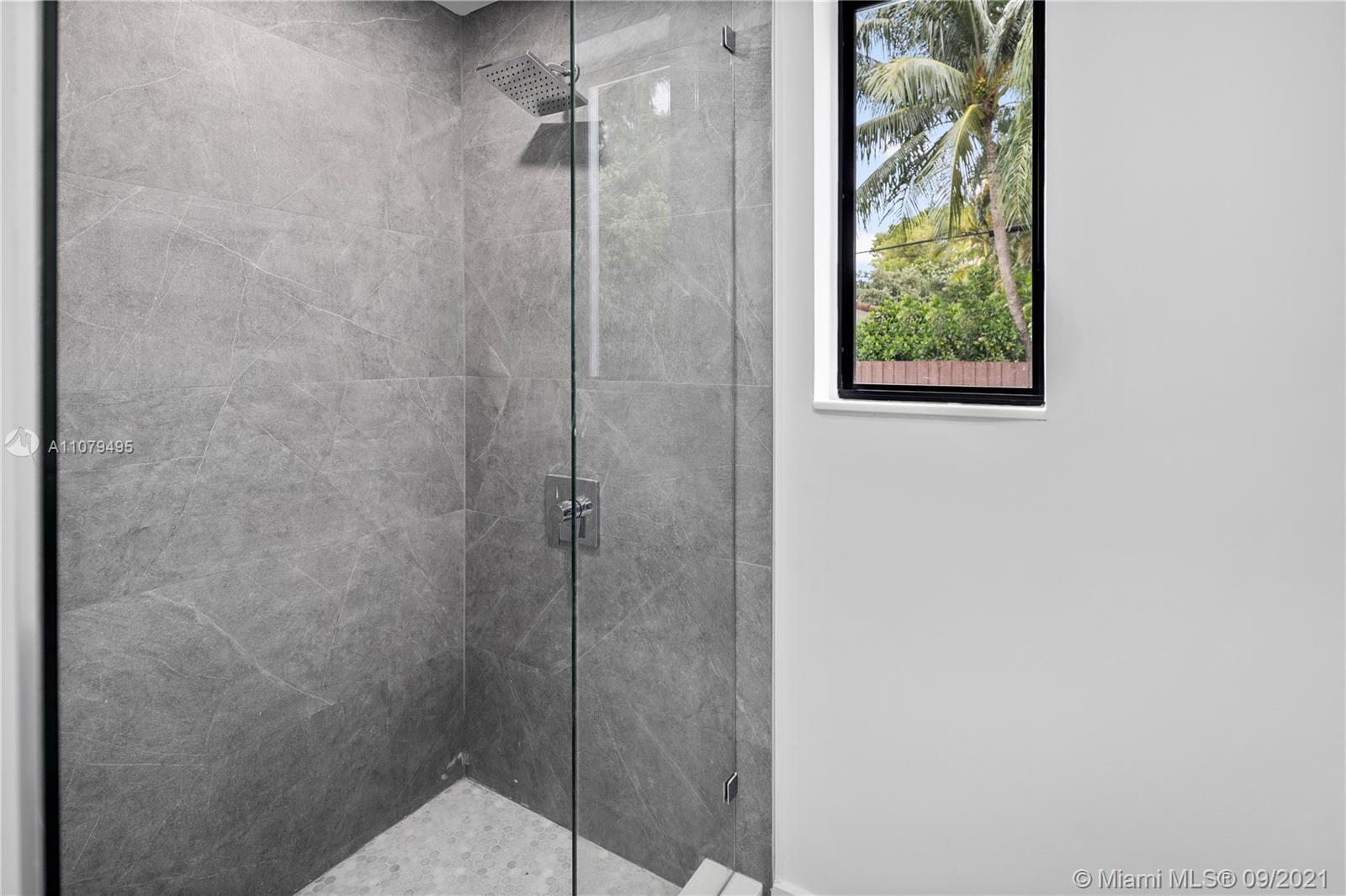 4450 Alton Road Miami Beach, FL 33140 - Photo 21 of 35 a bathroom with a shower