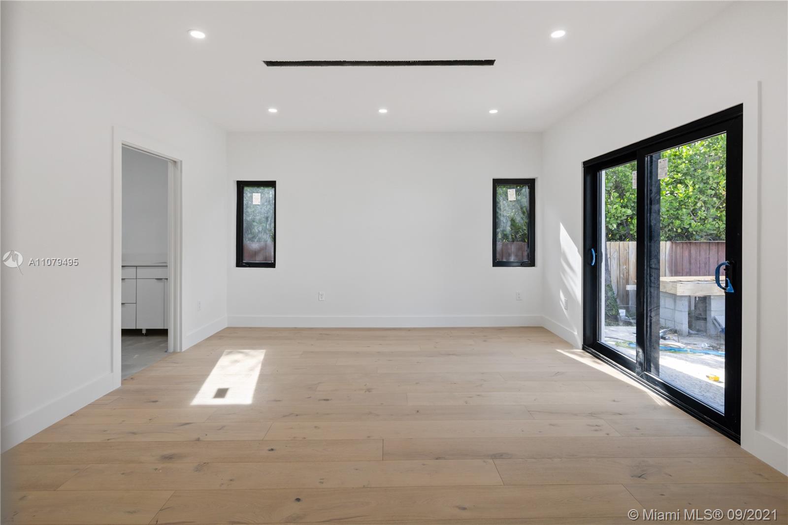 4450 Alton Road Miami Beach, FL 33140 - Photo 25 of 35 a view of an empty room with glass door