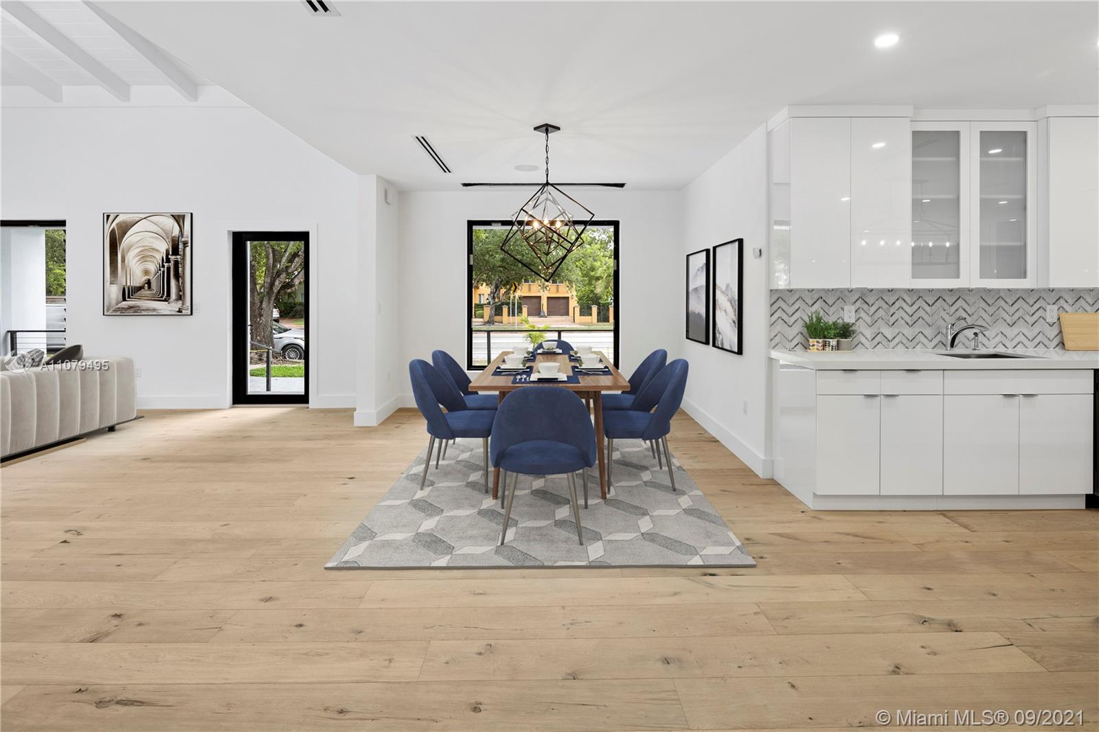 4450 Alton Road Miami Beach, FL 33140 - Photo 10 of 35 a view of a livingroom with furniture window and wooden floor