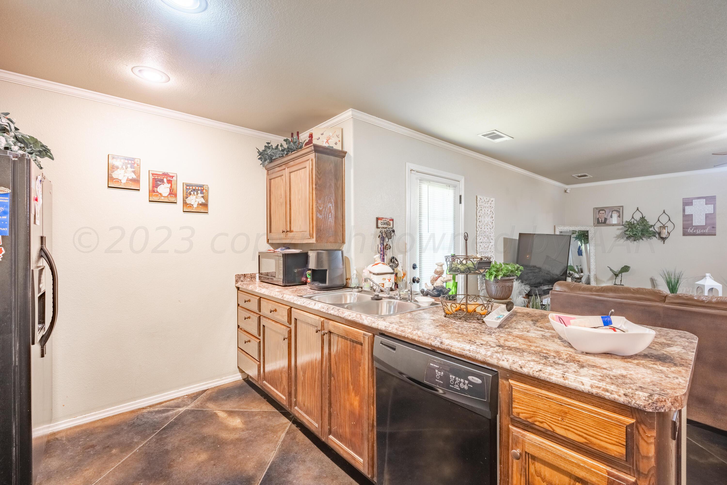 4502 Pine Street Amarillo, TX 79118 - Photo 8 of 20 a bathroom with a granite countertop sink mirror and a