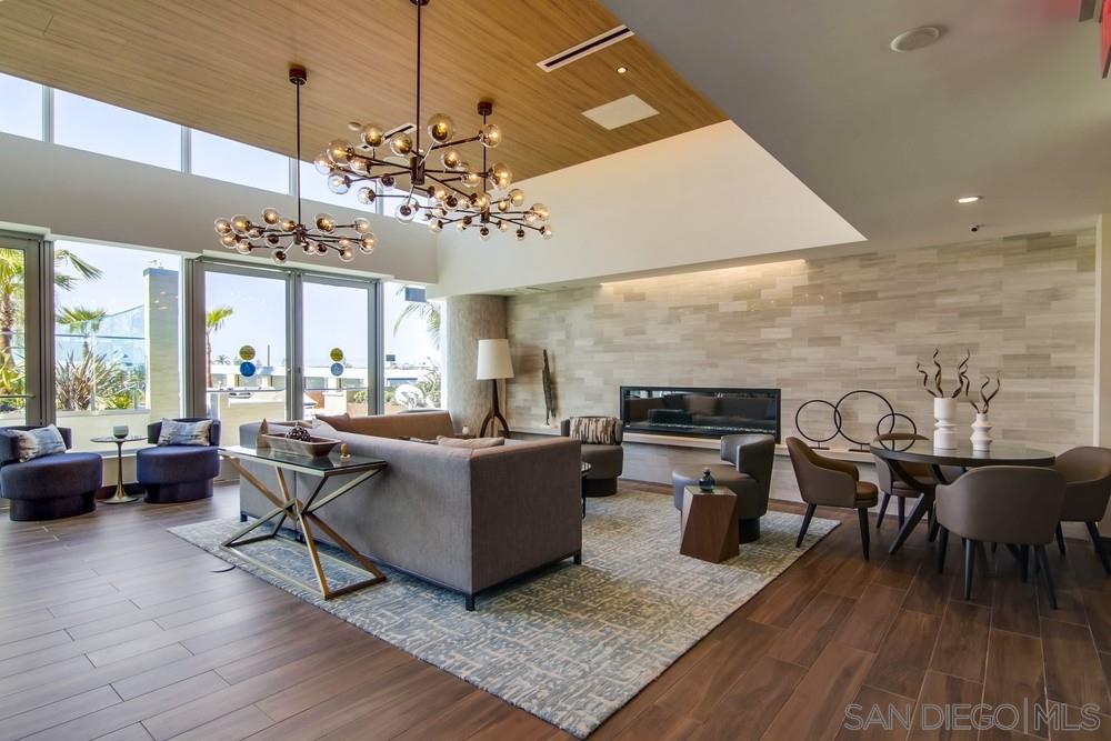 888 E Street, Unit 3502 San Diego, CA 92101 - Photo 20 of 35 a living room with fireplace furniture and a chandelier