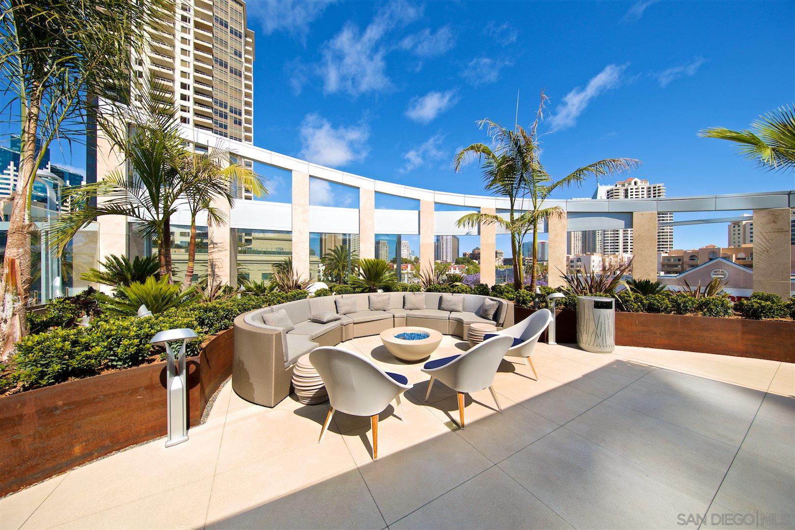 888 E Street, Unit 3502 San Diego, CA 92101 - Photo 25 of 35 a view of a patio with couches table and chairs and potted plants