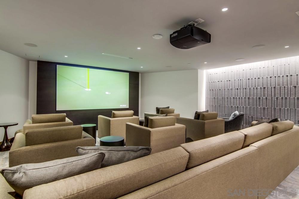 888 E Street, Unit 3502 San Diego, CA 92101 - Photo 27 of 35 a media room with lots of chairs and a projector screen