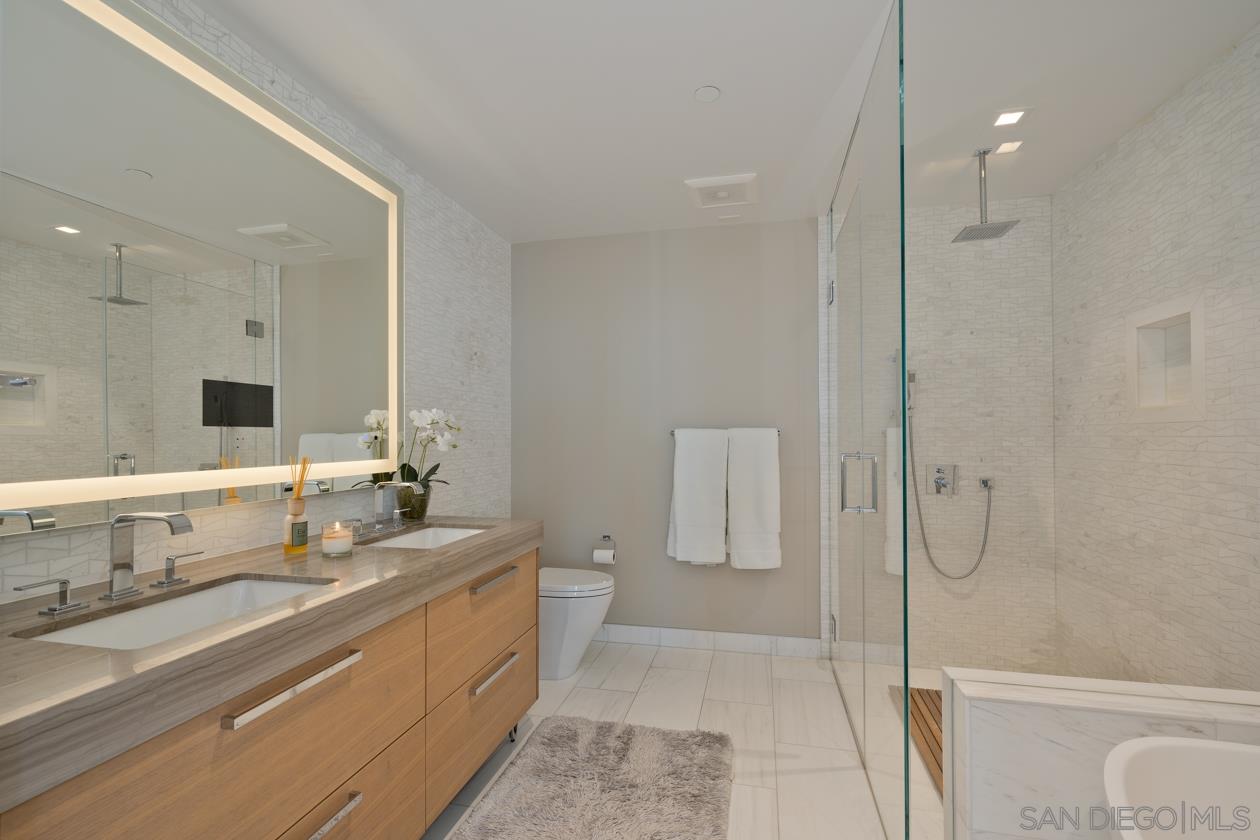 888 E Street, Unit 3502 San Diego, CA 92101 - Photo 7 of 35 a bathroom with a double vanity sink mirror and double