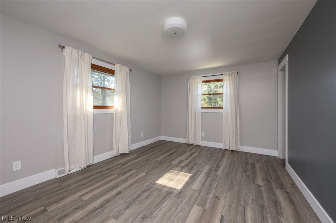 5210 Sibila Road Northwest Canton, OH 44718 - Photo 13 of 36 Bedroom with multiple windows, closet system and LVT flooring