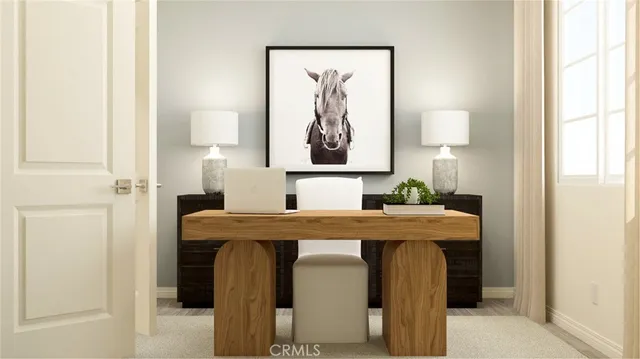 a view of a dining room with a table and chairs