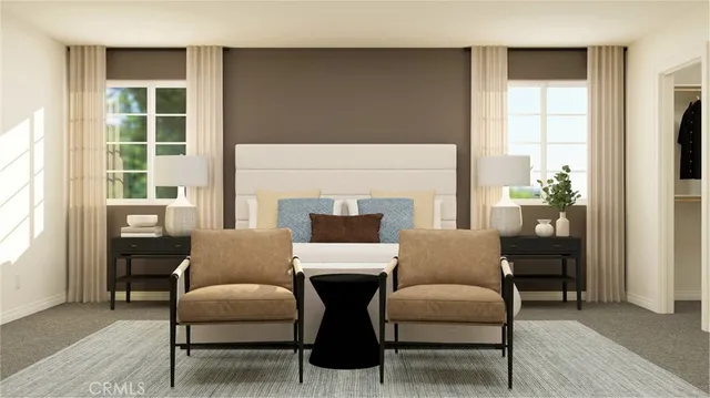 a living room with furniture a large window and a fireplace