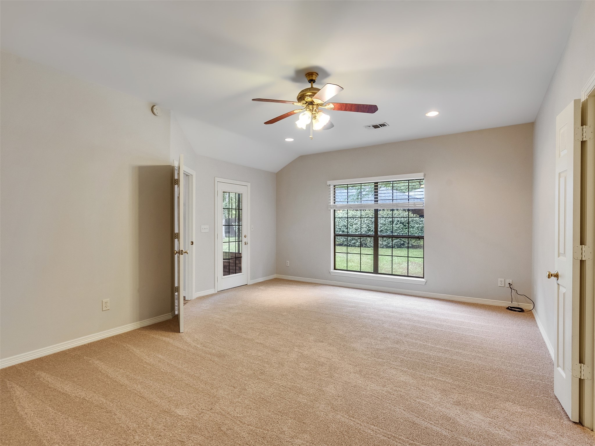 195 Coral Gables Trinity, TX 75862 - Photo 21 of 50 a view of an empty room with a window