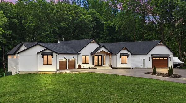 a front view of a house with a yard