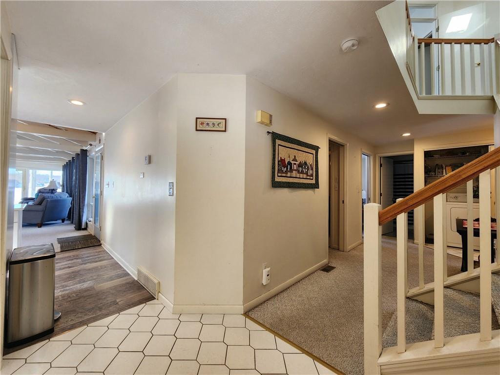 224 Latonka Drive Mercer, PA 16137 - Photo 14 of 42 a view of a hallway with wooden floor and windows