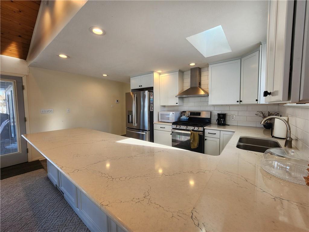 224 Latonka Drive Mercer, PA 16137 - Photo 19 of 42 a kitchen with stainless steel appliances a refrigerator sink and cabinets