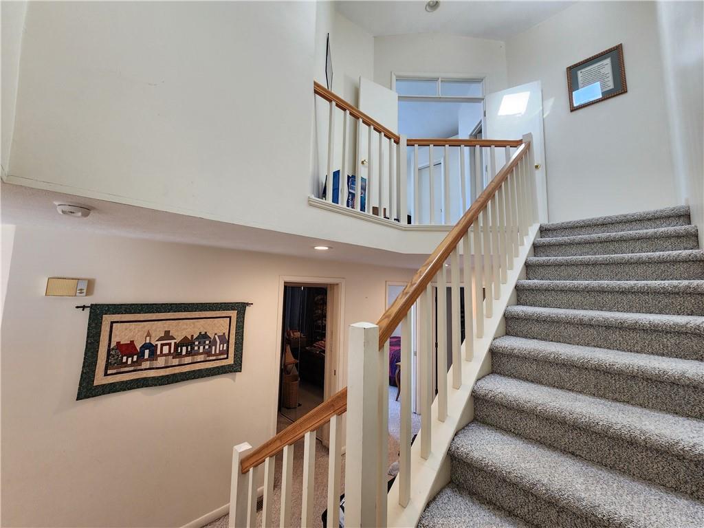 224 Latonka Drive Mercer, PA 16137 - Photo 35 of 42 a view of staircase with lots of frames on wall and a large window