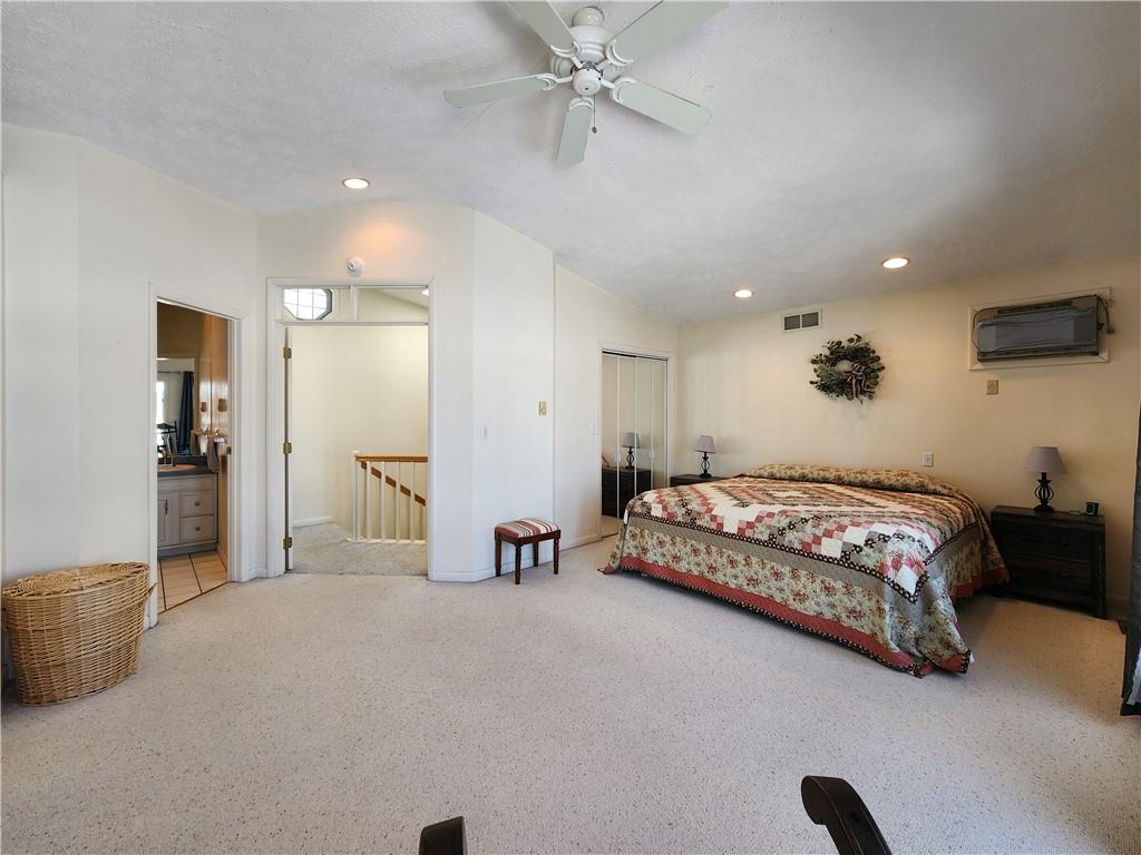 224 Latonka Drive Mercer, PA 16137 - Photo 38 of 42 a large bedroom with a bed and a view of cabinet