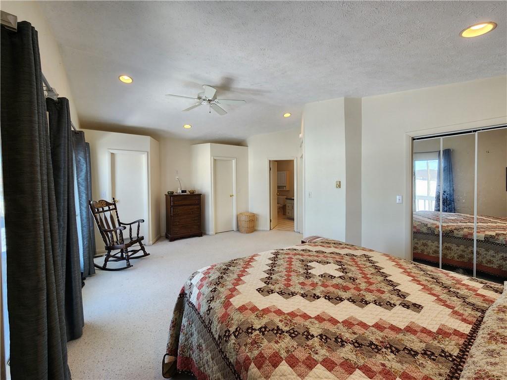 224 Latonka Drive Mercer, PA 16137 - Photo 42 of 42 a spacious bedroom with a bed and a large mirror