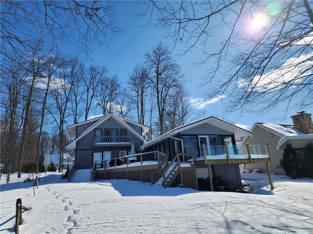 224 Latonka Drive Mercer, PA 16137 - Photo 5 of 42 a front view of a house with a yard covered in snow