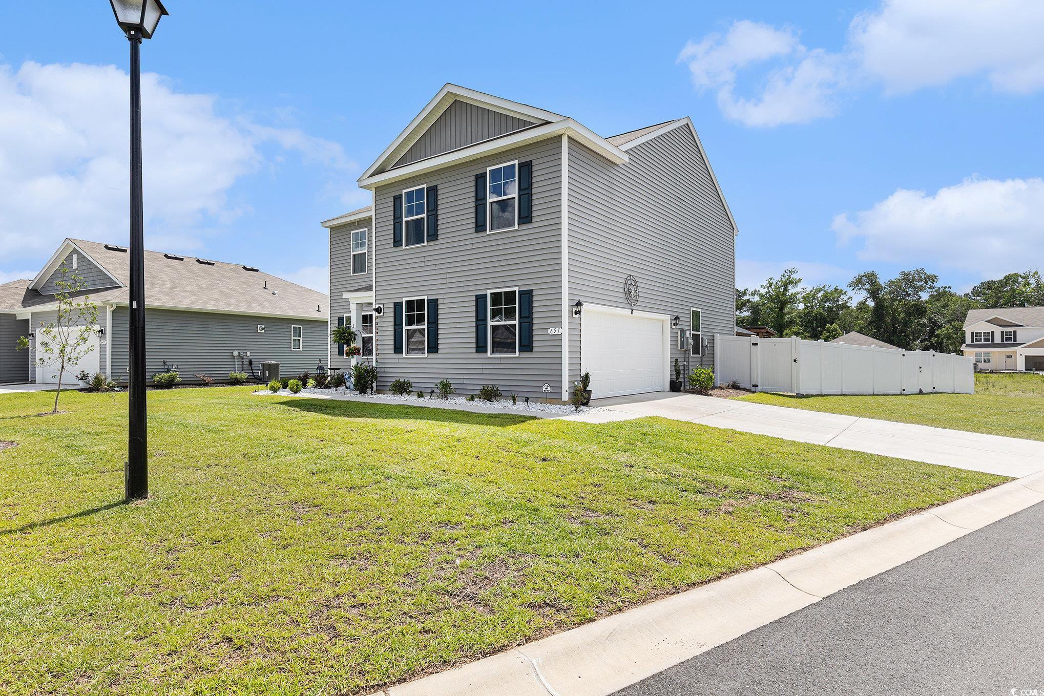 651 Choctaw Drive Conway, SC 29526 - Photo 1 of 37 View of front of property featuring a gate, driveway, and an attached garage
