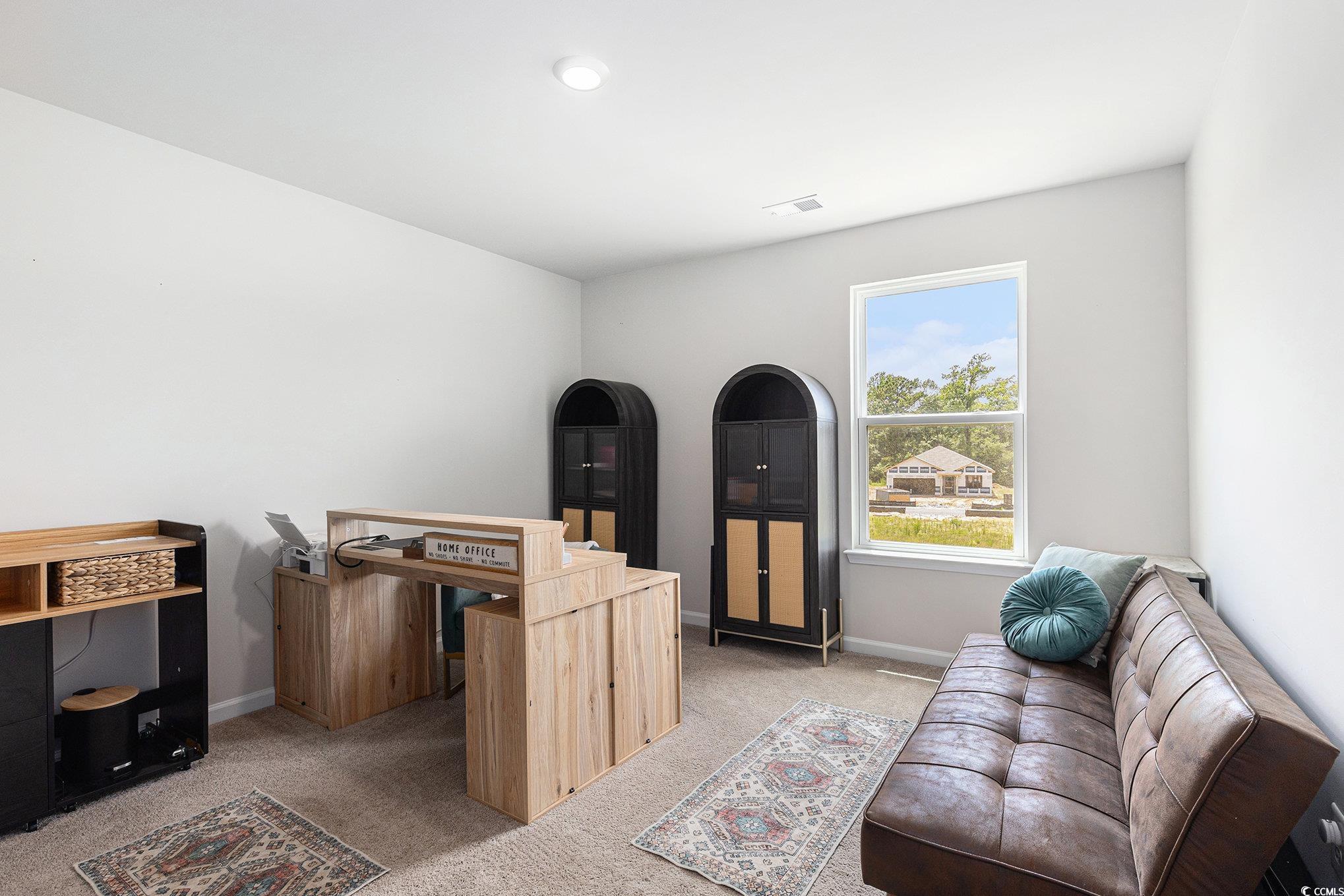 651 Choctaw Drive Conway, SC 29526 - Photo 12 of 37 Living room with light colored carpet and baseboards