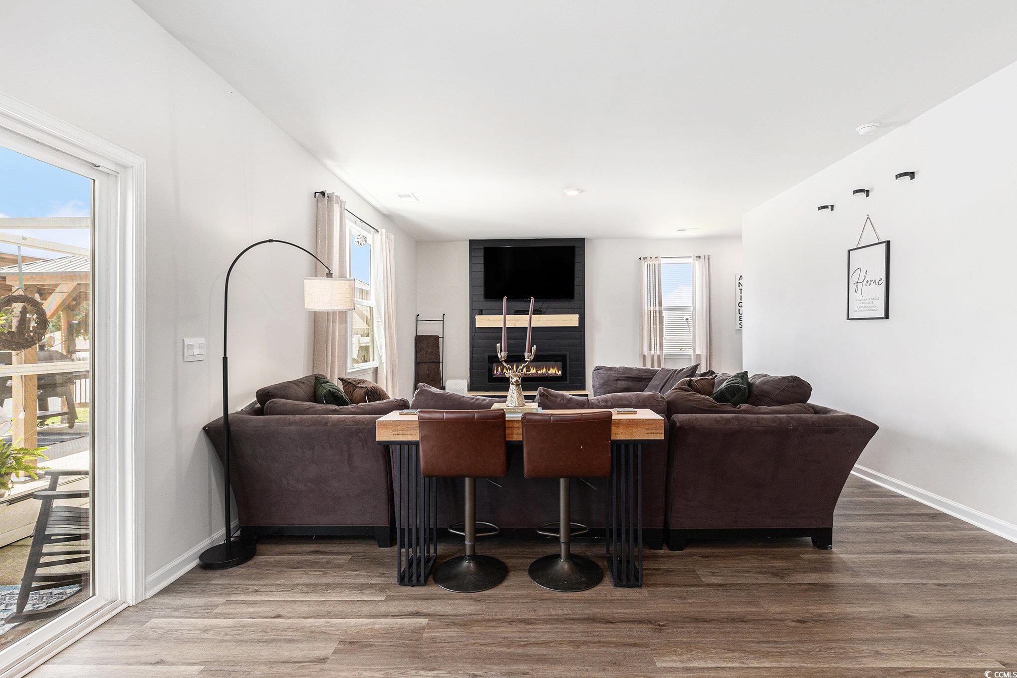 651 Choctaw Drive Conway, SC 29526 - Photo 13 of 37 Living room featuring a large fireplace and wood finished floors